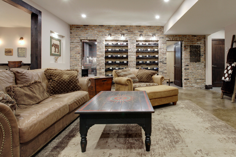 Elegant industrial custom designed exposed brick wine wall  by a renowned New Home Designer in Calgary.