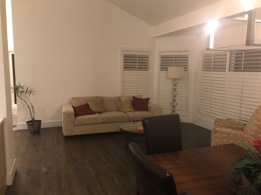 A before photo of a dark and dingy sitting room before it was redesigned into a beautiful modern kitchen by top Calgary Interior Designer