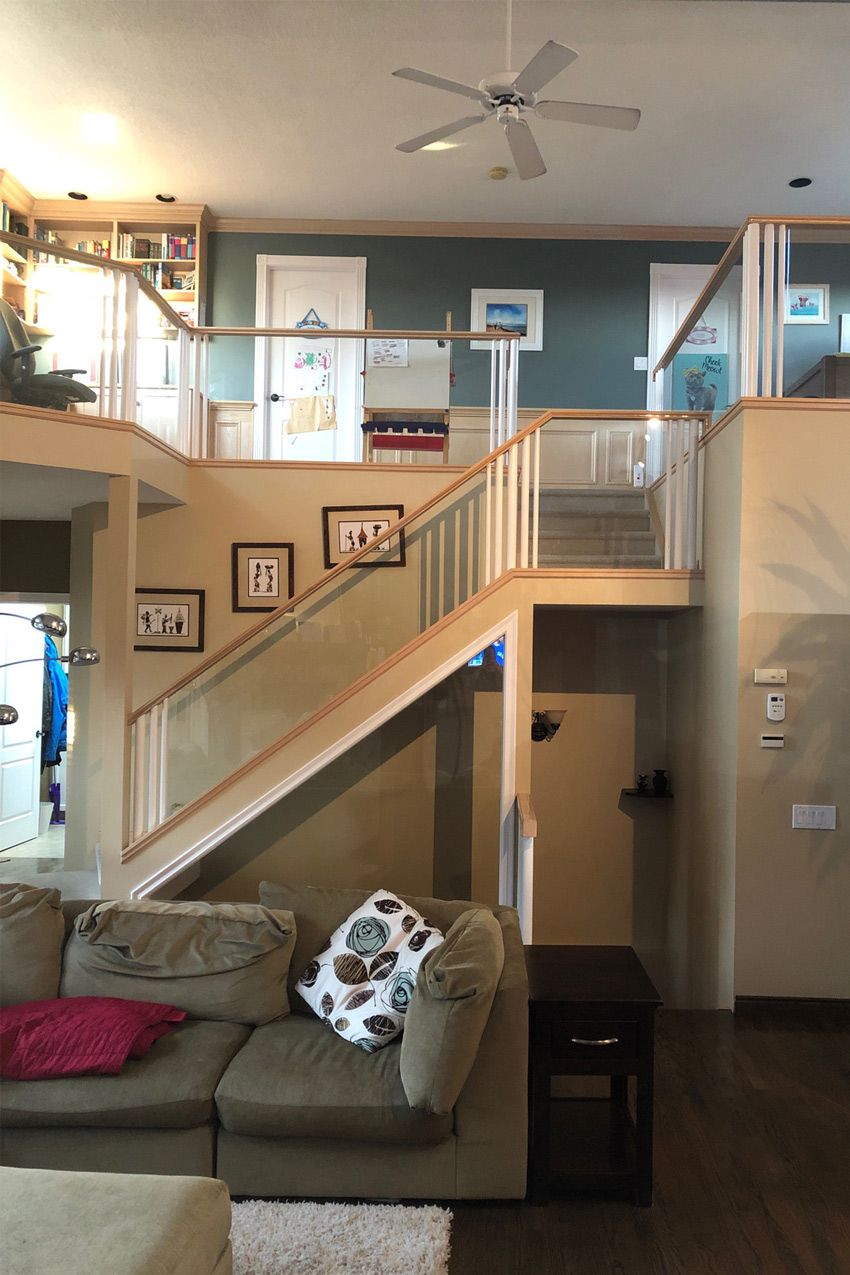 The Before Photos: A beautiful transformation of a home in Signal Hill, looking at the old staircase, with the new space designed by top Calgary Interior Designer