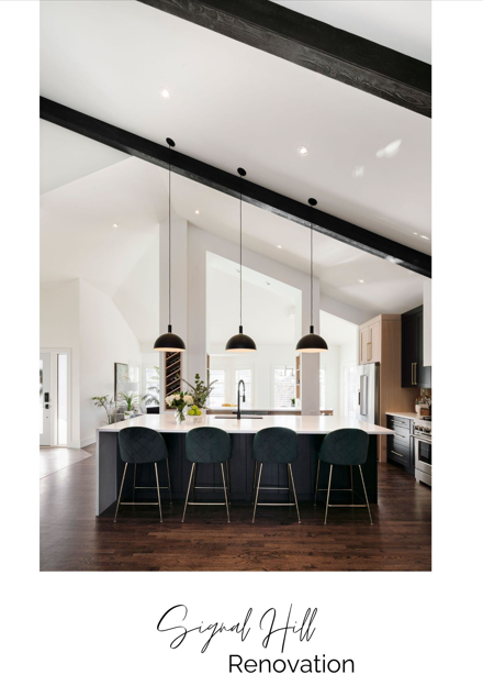 Modern kitchen with black accents, pendant lighting, and a view into an adjacent living area, designed by a top Calgary interior designer.