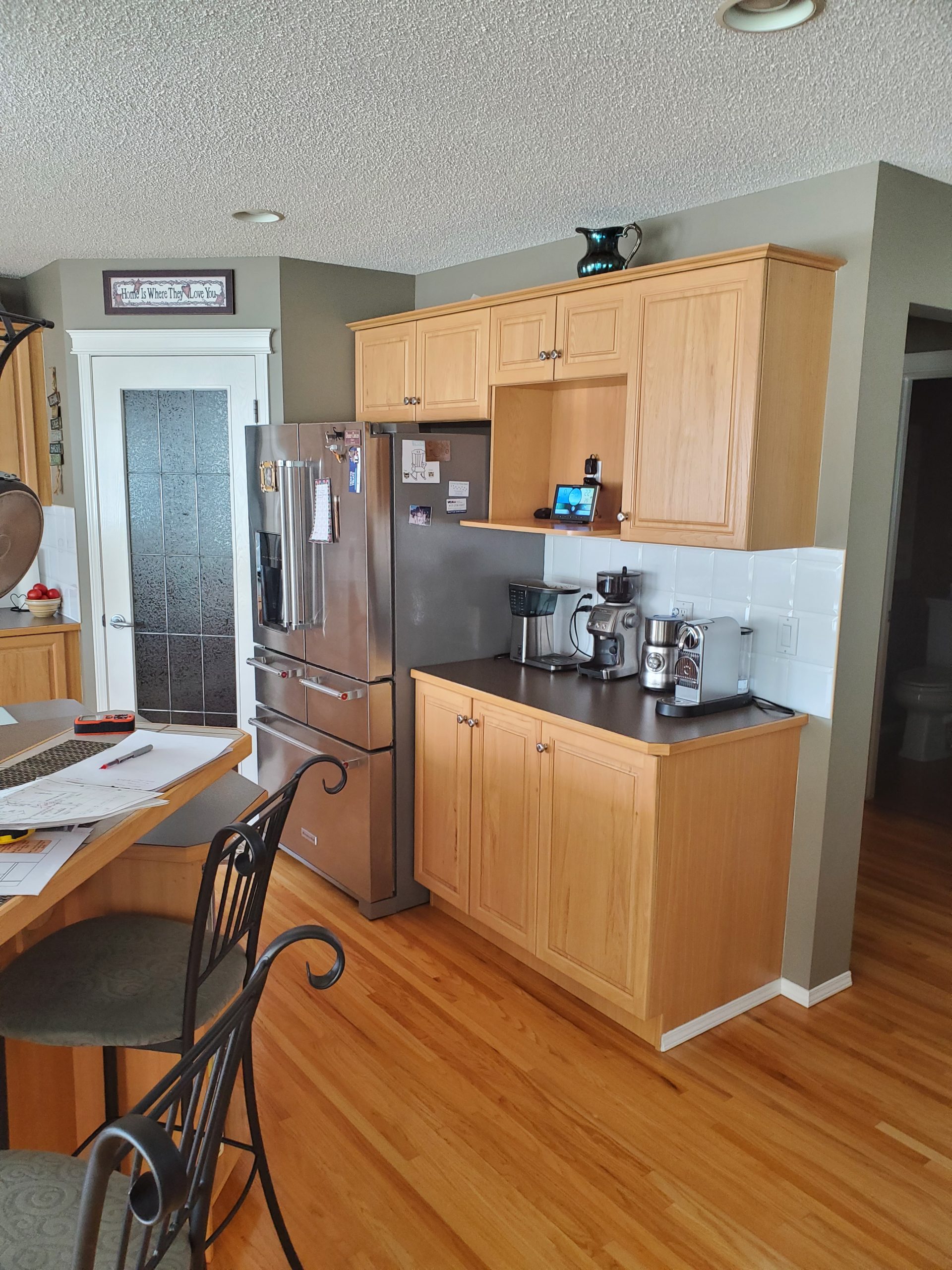 Before: A dated kitchen ready for a thoughtful transformation—reimagined to improve flow, function, and create a fresh, timeless feel.
