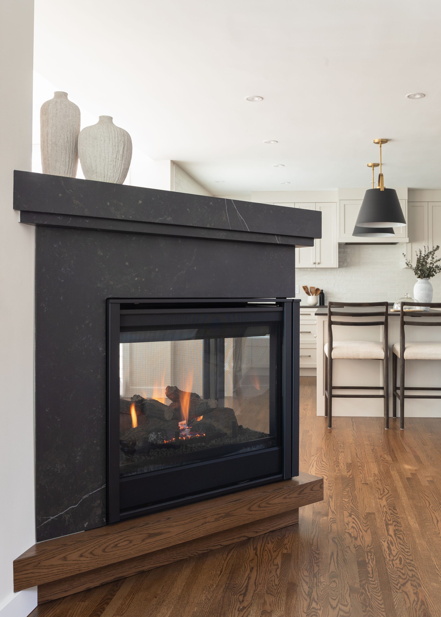 Modern living room with black stone fireplace