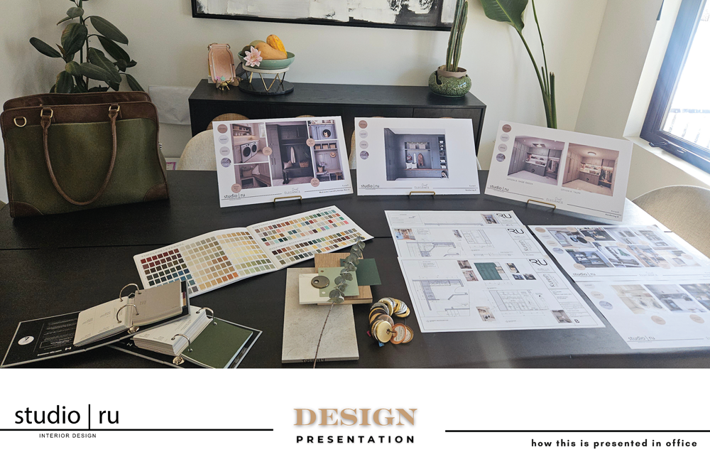 Studio Ru interior design presentation with concept boards, construction drawings, material samples, colour selections and finish options arranged for a client meeting.