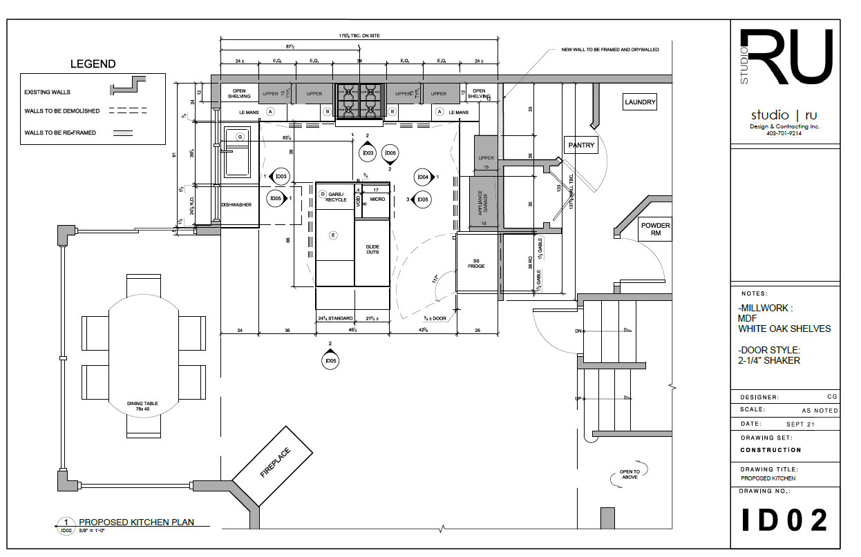Architectural floor plan showing a proposed kitchen renovation with a large central island, custom cabinetry, appliances, dining area, pantry, laundry room, and adjacent powder room by Studio Ru Interior Design.